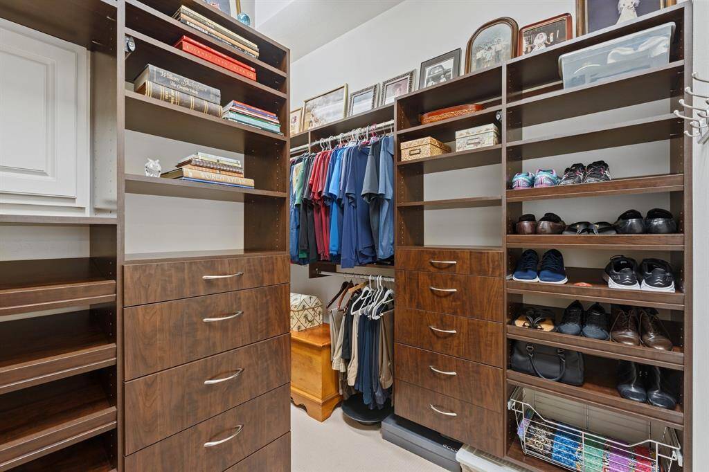 Closet is fitted with these good looking organization systems.