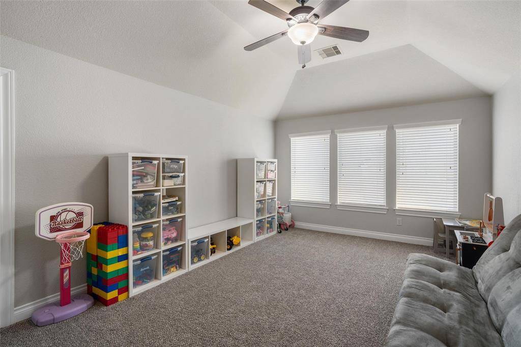 This expansive upstairs game room offers the perfect space for entertainment and relaxation. Whether you're hosting game nights, enjoying family time, or setting up a personal hobby space, this versatile room can adapt to your needs. Its convenient location upstairs provides a quiet retreat, separate from the main living areas, making it ideal for both fun and privacy
