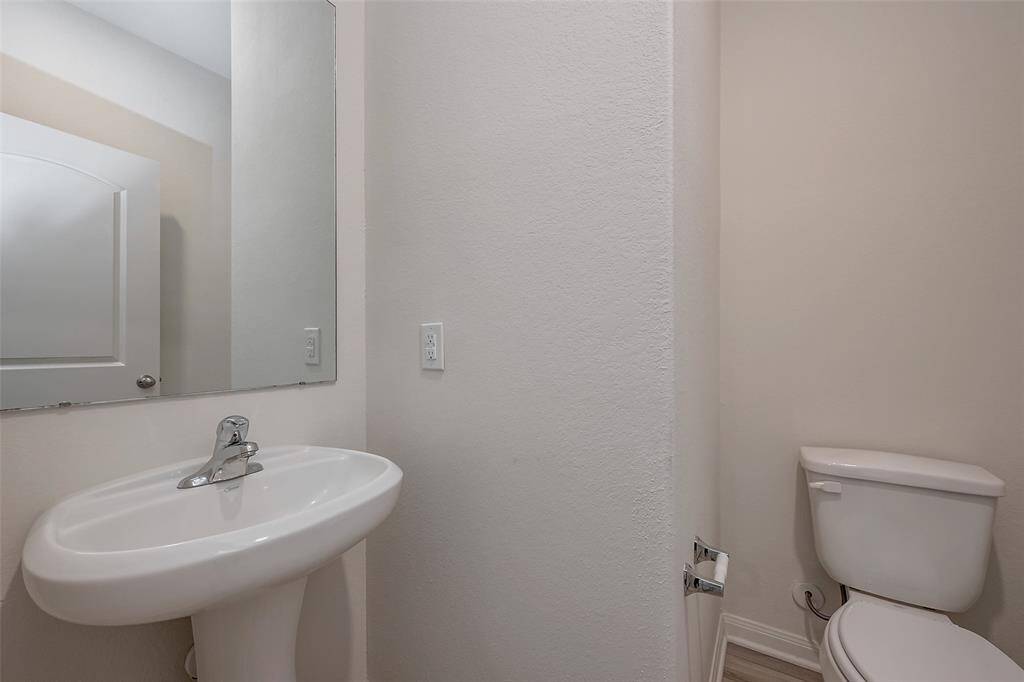 Half bathroom conveniently located downstairs.