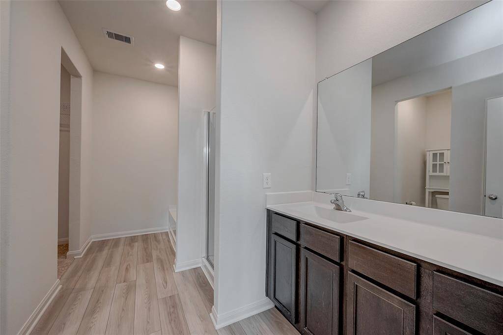 The primary bathroom features a separate shower and soaking tub and large closet.