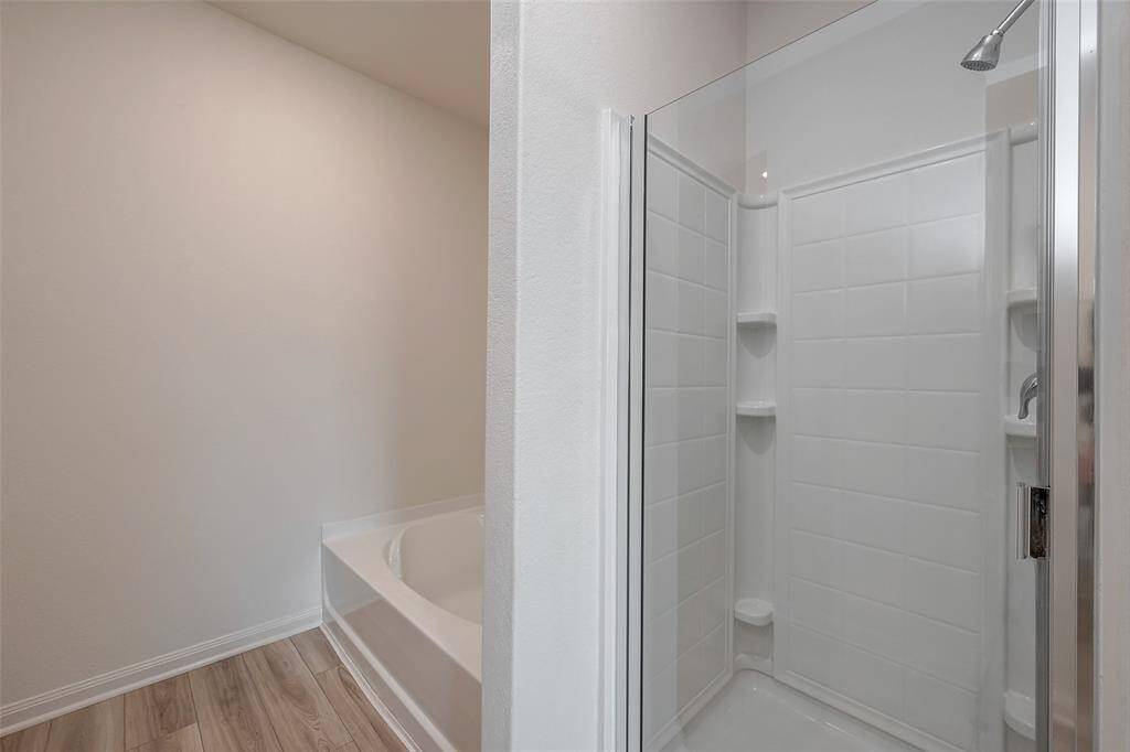 Separate shower in the primary bathroom.