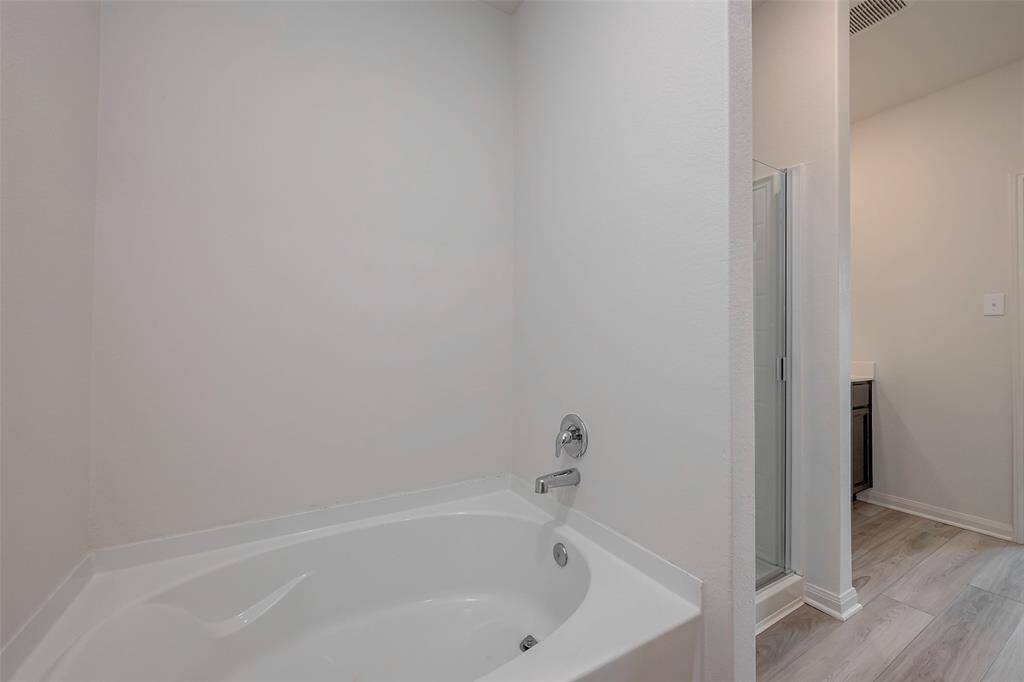 Large soaking tub in the primary bathroom.