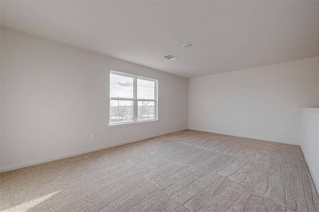 Secondary bedroom 4 upstairs with large closet.