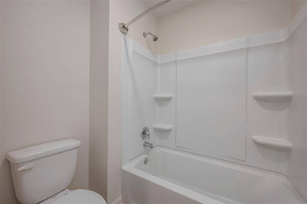 Closer look at the shower/tub combo in the upstairs secondary bathroom.