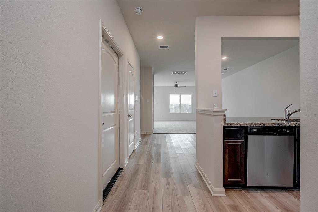 As you enter, direct access to the 2 car garage is on the left.