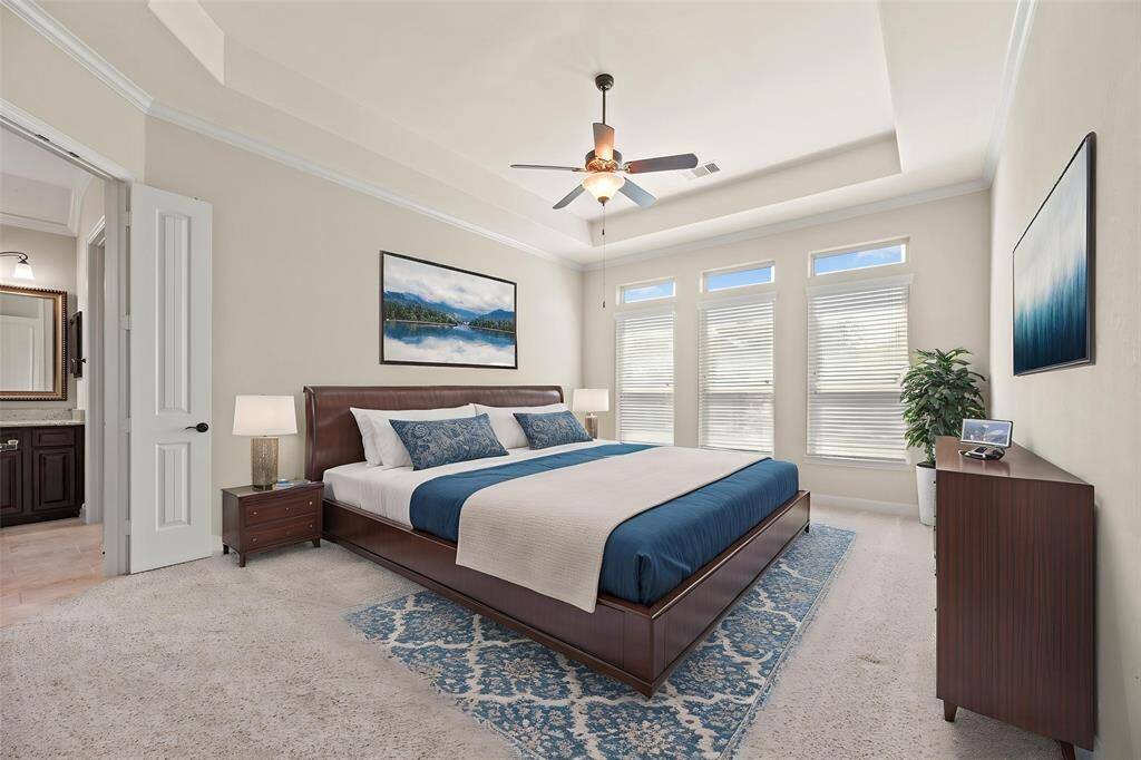 How perfect is this primary suite? Spacious and filled with natural light, this serene retreat offers the ultimate escape, promising comfort, tranquility, and pure relaxation. - virtually staged