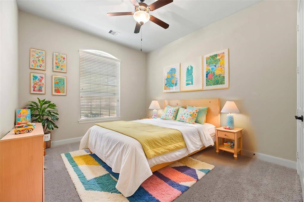 The thoughtfully designed layout of your second bedroom allows for natural light to flood the room, creating a warm and welcoming atmosphere. - virtually staged