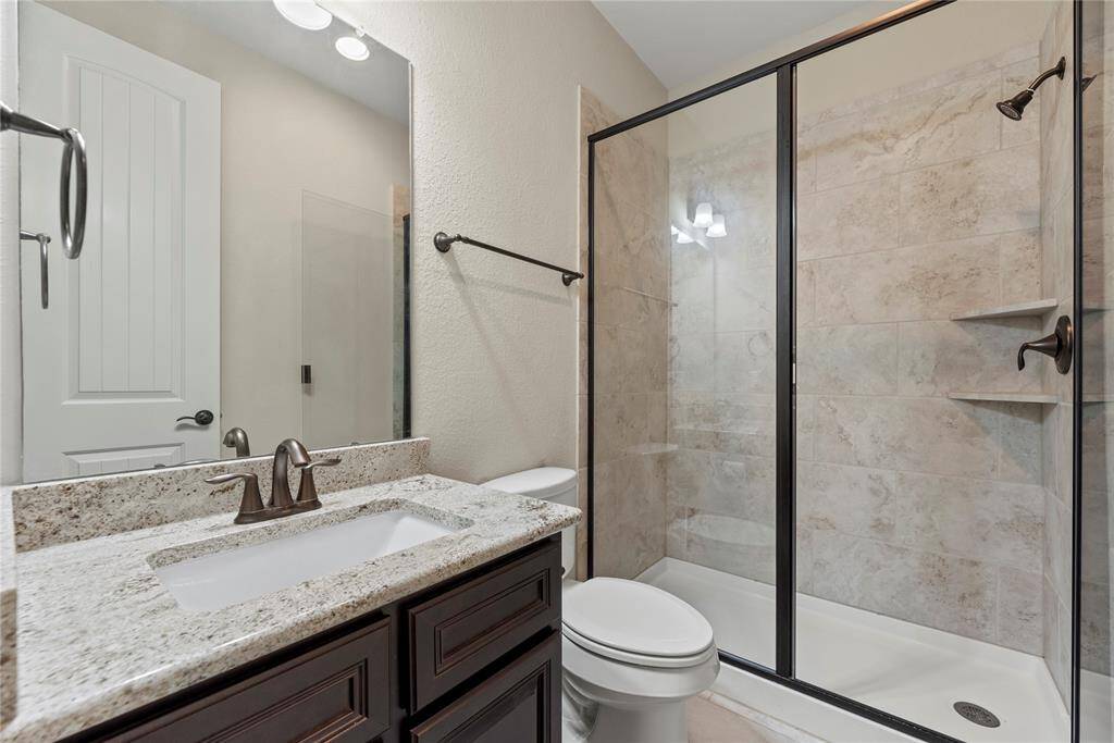 The generously sized secondary bath provides plenty of space, seamlessly blending comfort and functionality for a refreshing and relaxing retreat.