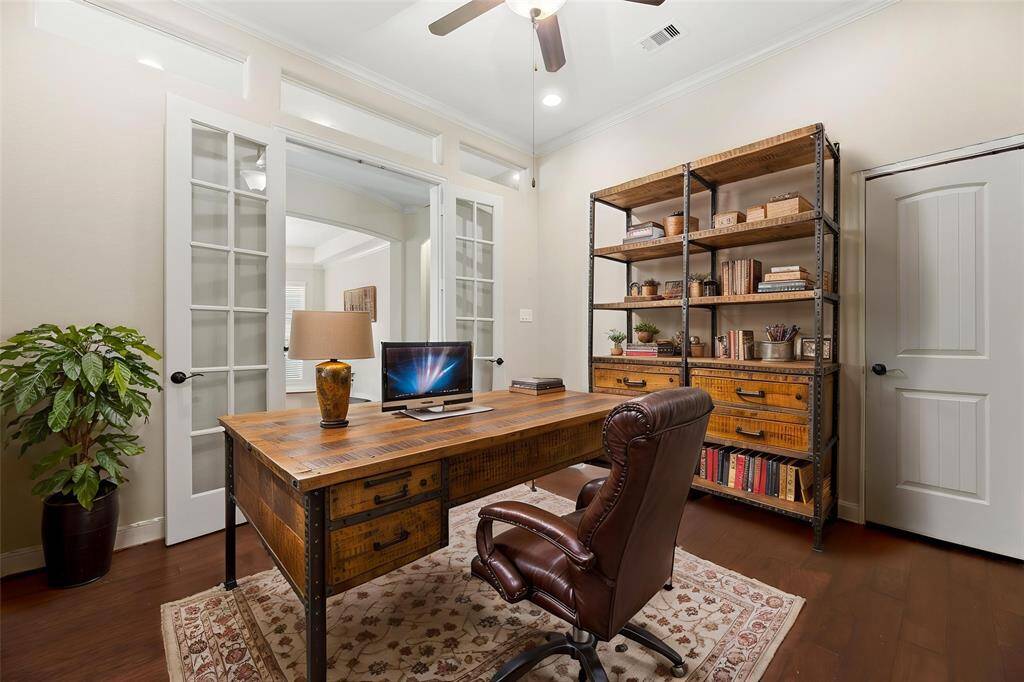 A private study through double glass doors adds a touch of sophistication and privacy to the home. It suggests a space dedicated to concentration, creativity, and productivity. - virtually staged
