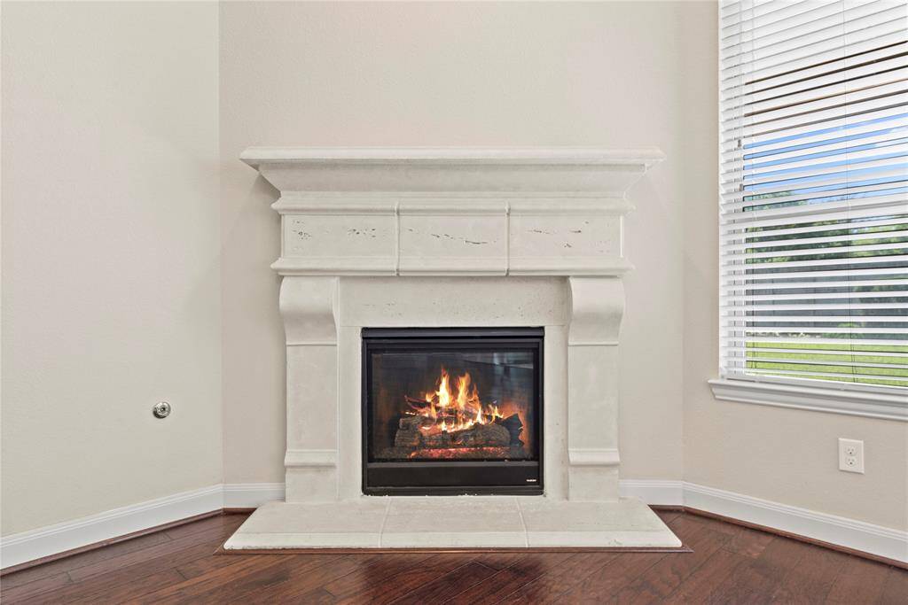 The inviting fireplace becomes a focal point that anchors the room and invites people to gather and linger, making it a cherished feature of the living area.