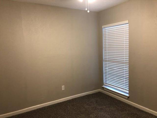 Secondary bedroom with ceiling fan, new carpet and mini-blinds
