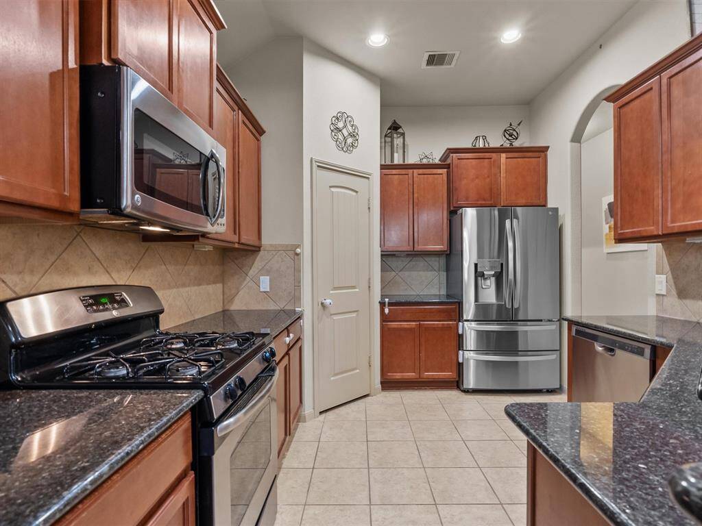 A corner pantry adds ample storage space for all the cooking necessities.