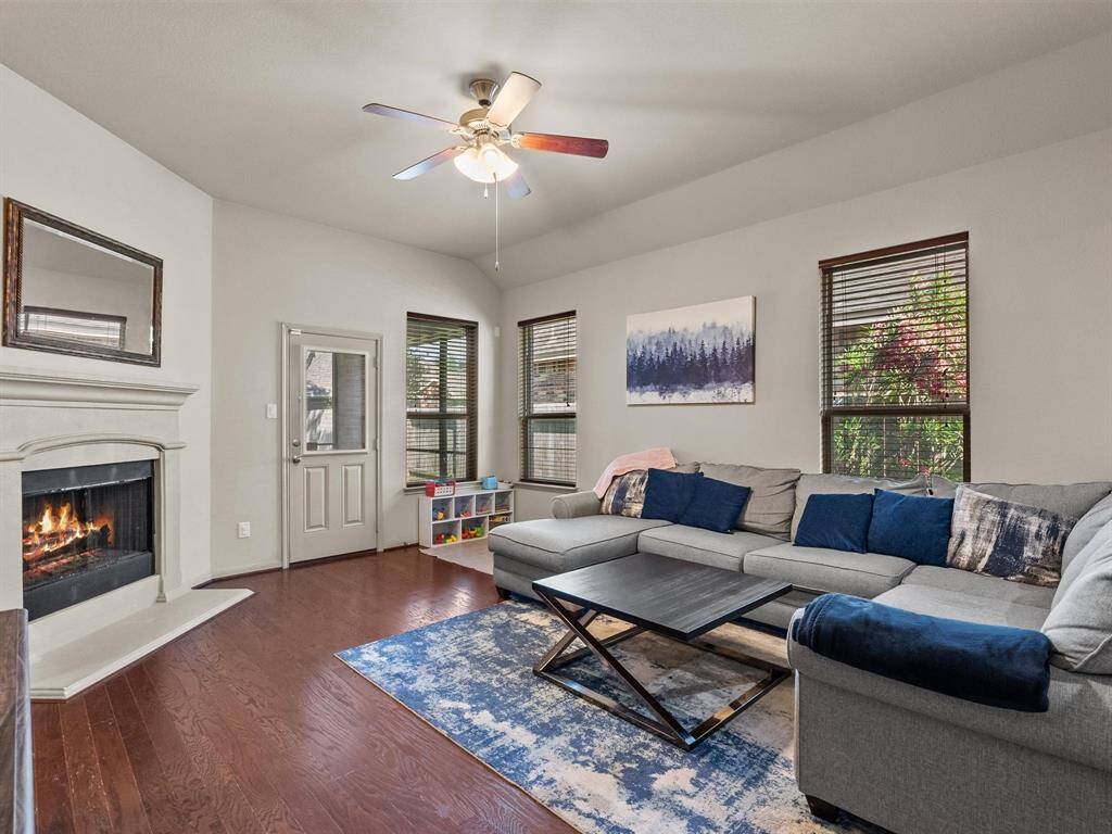 The spacious family room includes a gas fireplace for cozy evenings.
