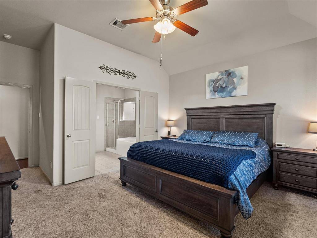 A view of the primary bedroom with the convenient ensuite.