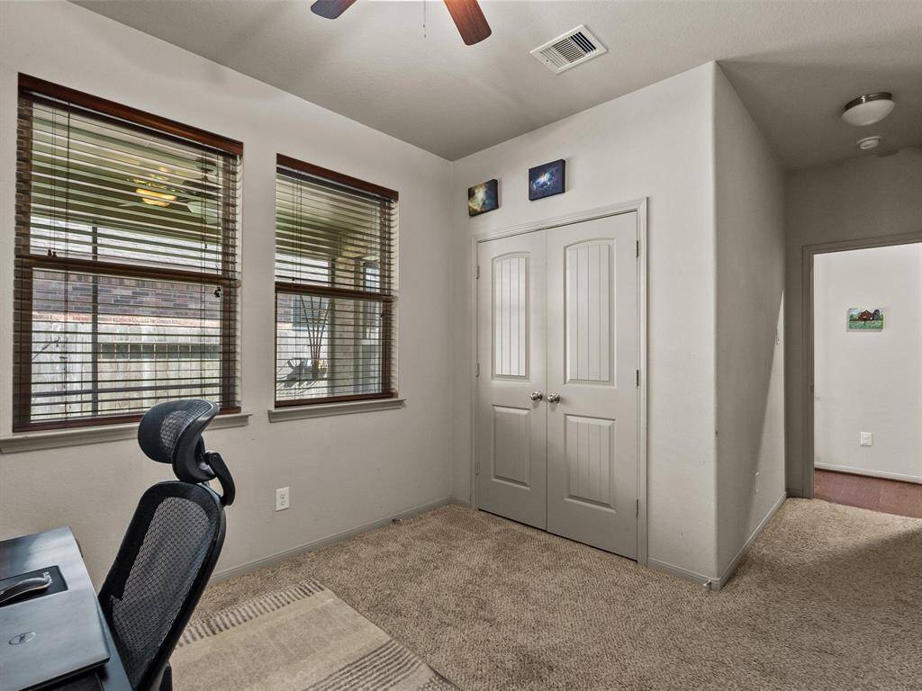 One of the three secondary bedrooms with ample closet space.