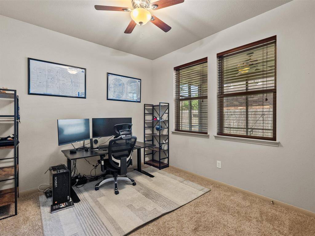 This bedroom is currently being used as a home office, but offers space for so many options.