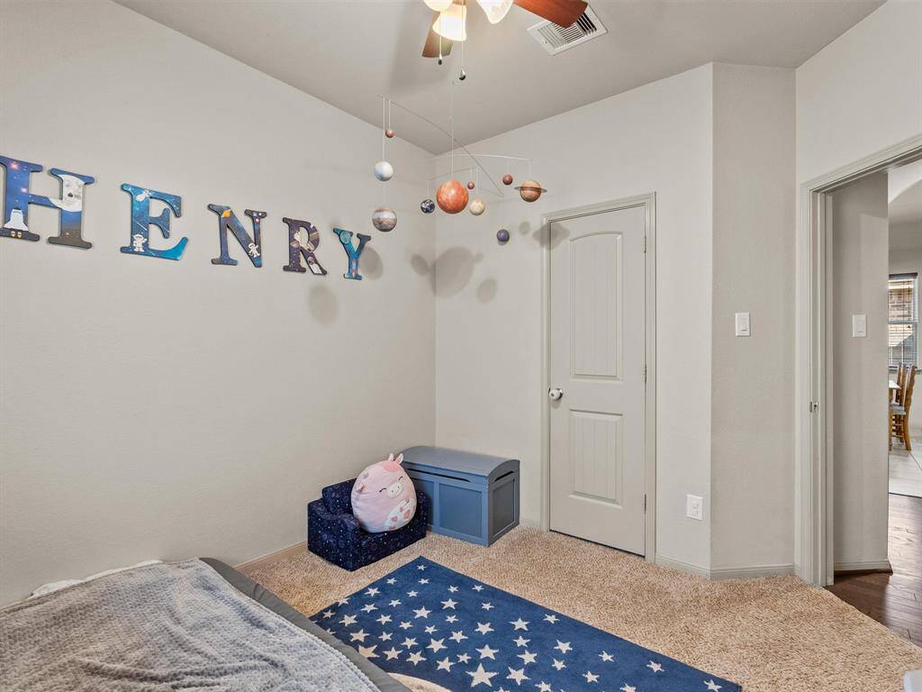 The second of the three secondary bedrooms.