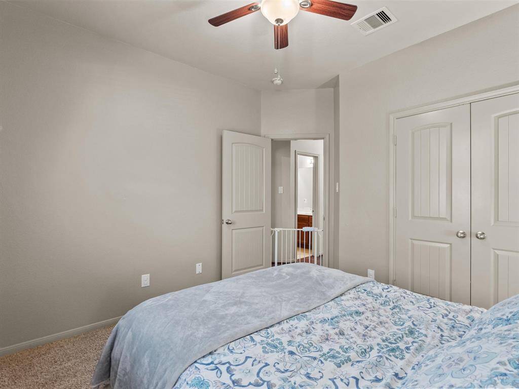 The third of the three secondary bedrooms.