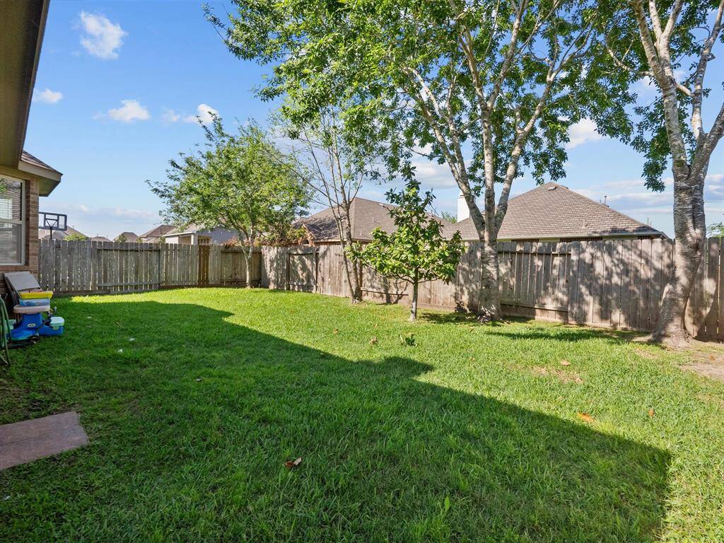 Picture yourself having gatherings with family and friends in this lovely backyard.