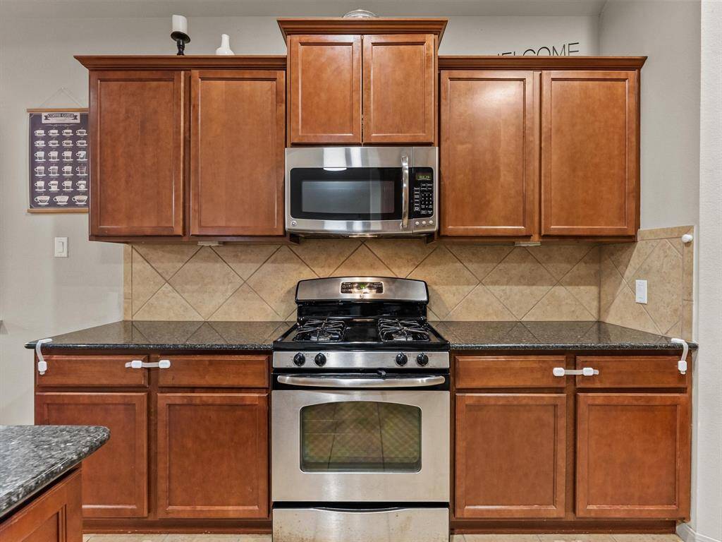 Stainless steel appliances add to this beautiful kitchen.