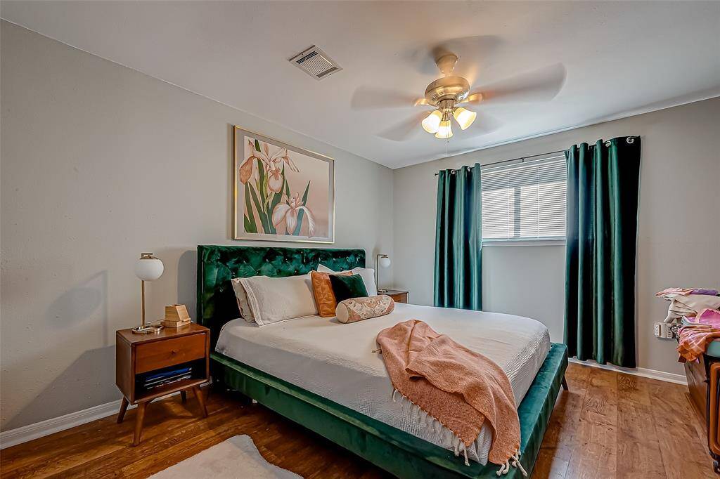 Primary bedroom is spacious and bright with a sitting room that could be a reading nook or office area!
