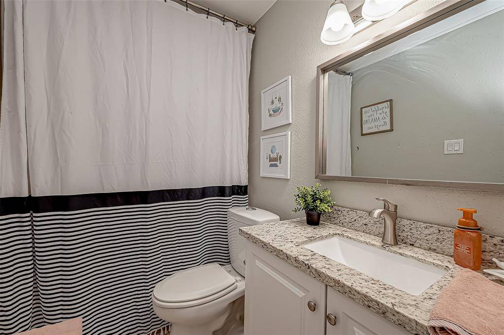 This is the second bathroom that has granite counters and a remodeled bath/shower