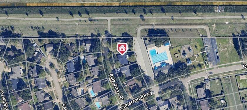 aerial view of the home, pool and walking trail!