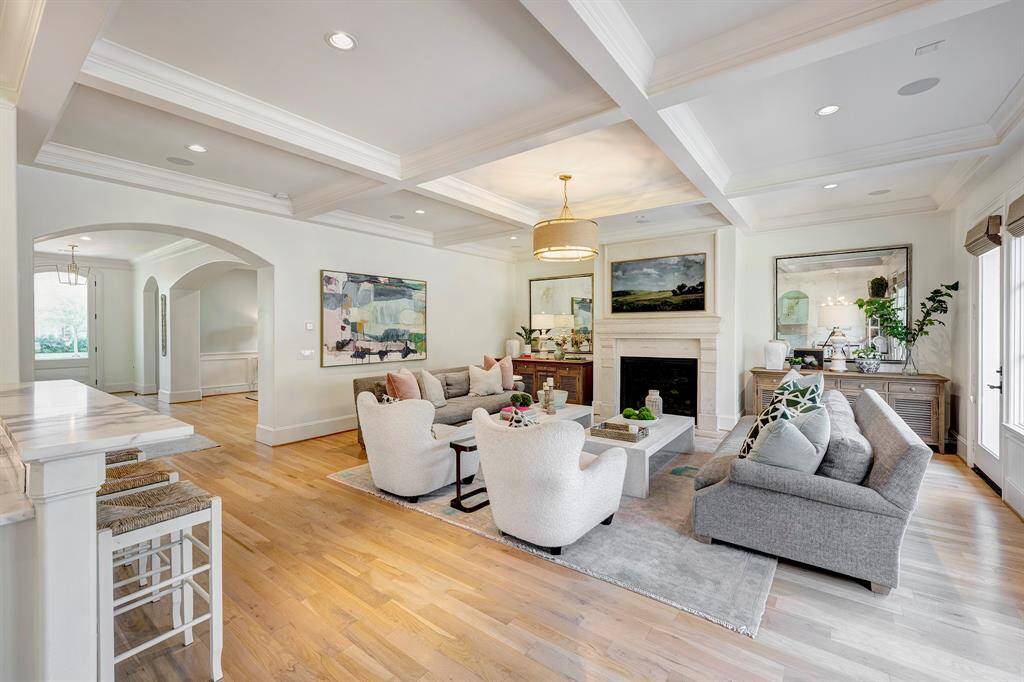 View of the family room looking towards the entry and formal dining room.