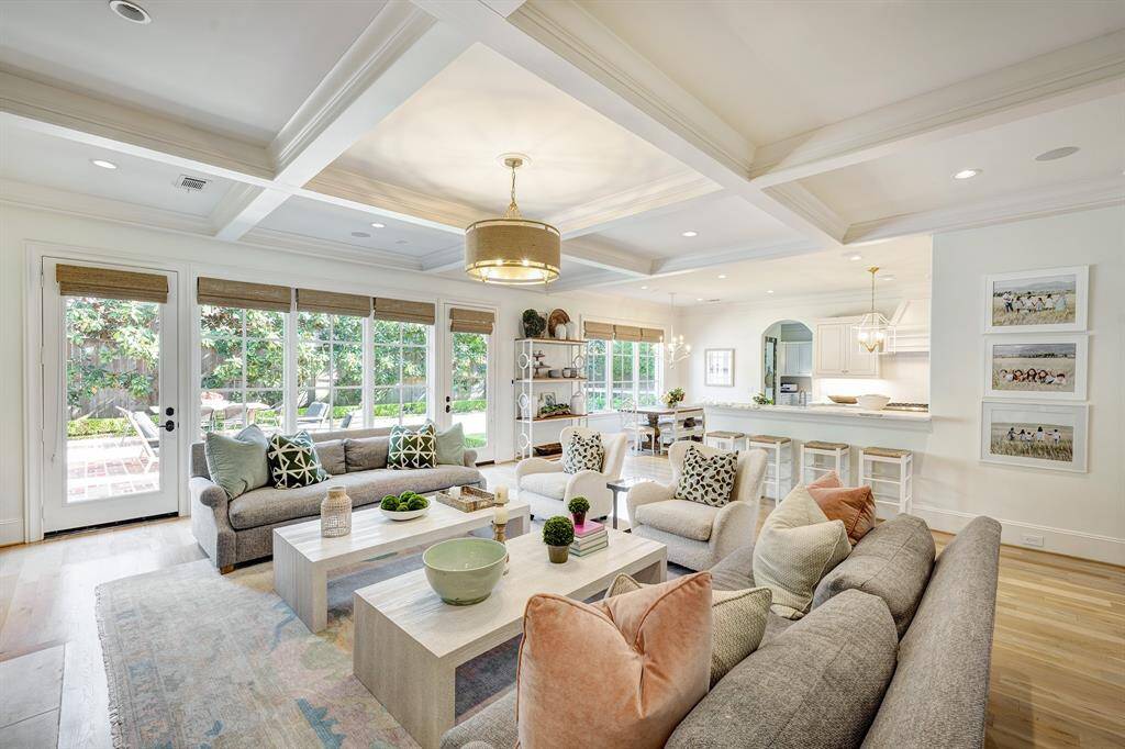 The family room flows seamlessly into the kitchen, creating an ideal space for effortless entertaining.