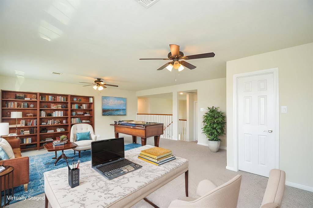 Virtually staged gameroom.  Would be great home school area.