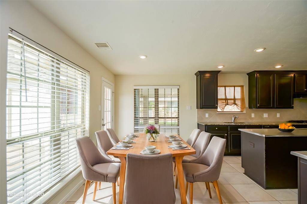 Virtually staged breakfast area.
