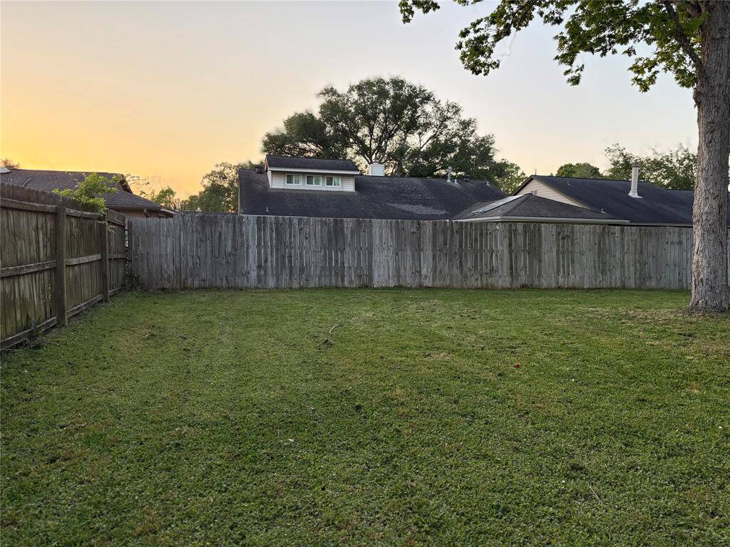 Huge backyard with new fence.