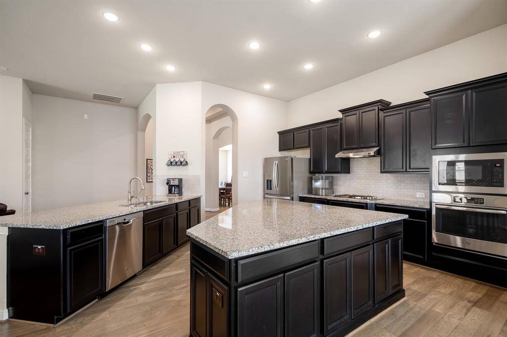 This kitchen will not disappoint! There is plenty of storage and counterspace making this kitchen every chef's dream! The extra-large kitchen island is perfect for conversation or that much needed space to lay out your party spread for everyone to enjoy.