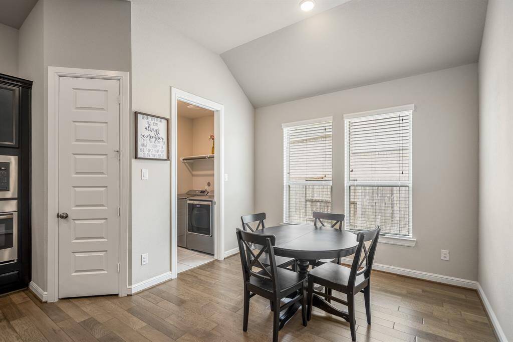 Start your day off right with a cup of coffee sitting with your family in the breakfast area! Featuring large windows, bright natural light, and wood floors.