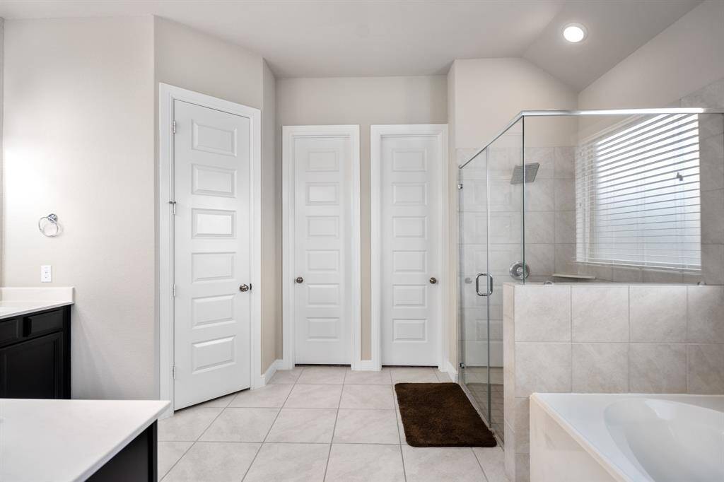 Indulge in the spaciousness of this primary retreat! With 2 separate primary closets, you'll love getting ready in this light and bright primary bathroom.