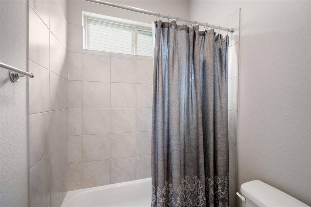 Attached to the shared vanity area, this combination tub and shower is conventiently located and easily accessible!