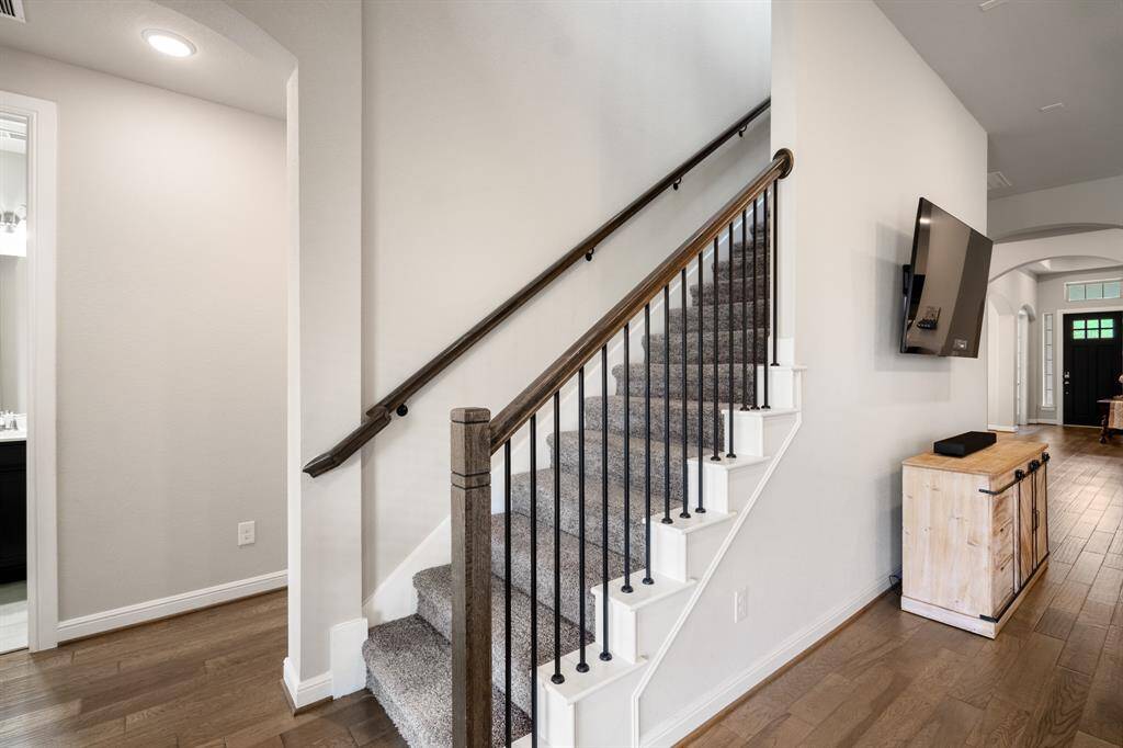 Head upstairs to find the huge game room, media room and half bath!
