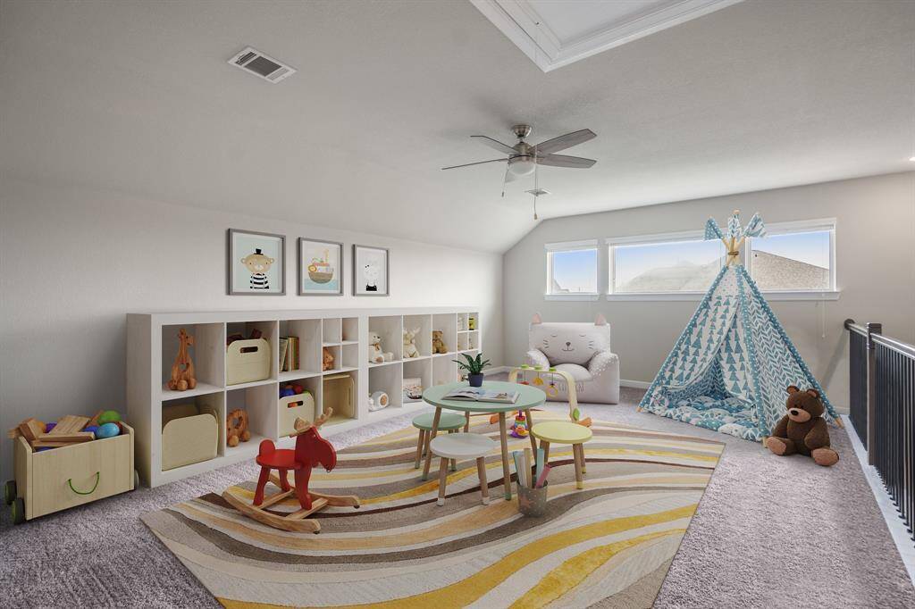 Upstairs you walk into a large game room that's perfect for a play room, pool table, or a lounging space! The large windows let in bright natural light. It's complete with plush carpet, a ceiling fan, and iron balusters giving it an open feel.  *This room has been virtually staged