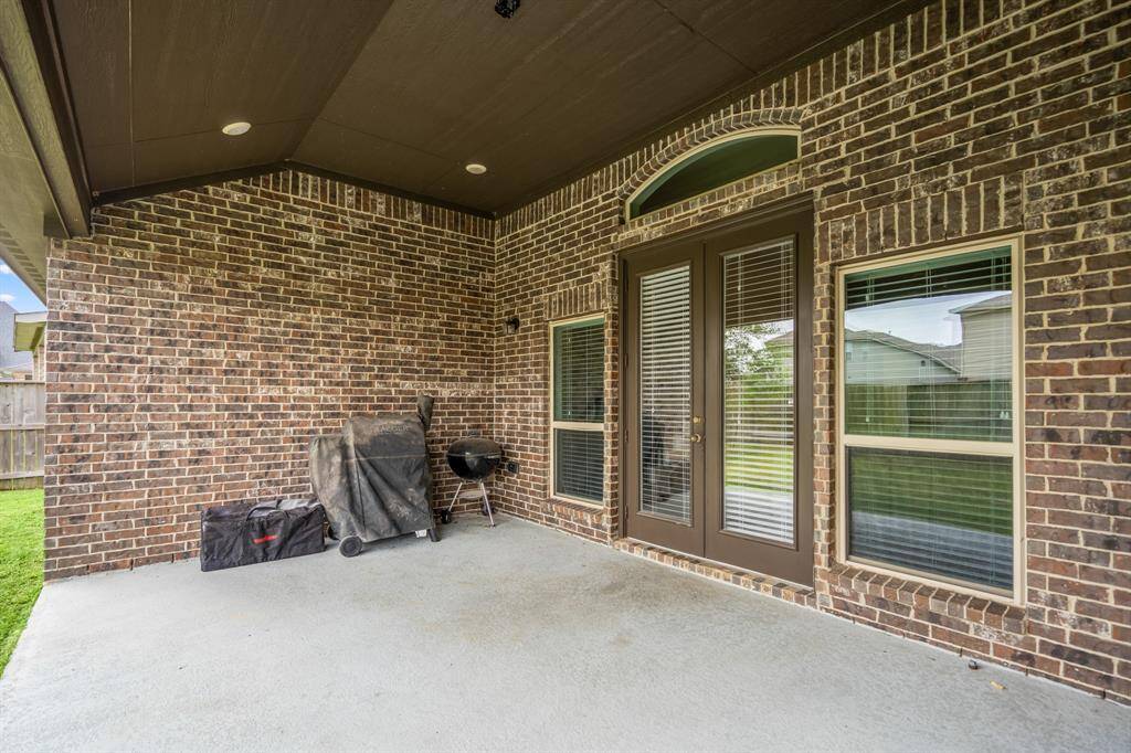 The covered patio is perfect for your outdoor living space, patio furniture, or BBQ pit! The french doors connect to the main living area making it great for indoor/outdoor living and entertaining.