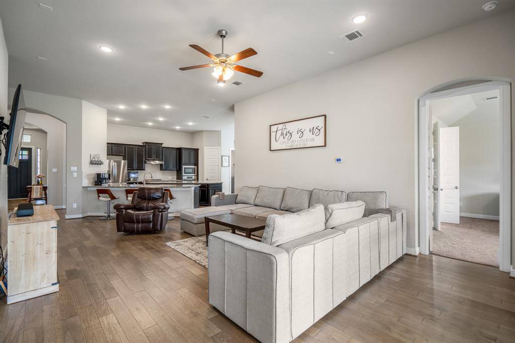 This thoughtfully designed open-concept layout offers a perfect blend of warmth and functionality. The open concept living room and kitchen makes for a great way to keep the party going and never miss a beat!