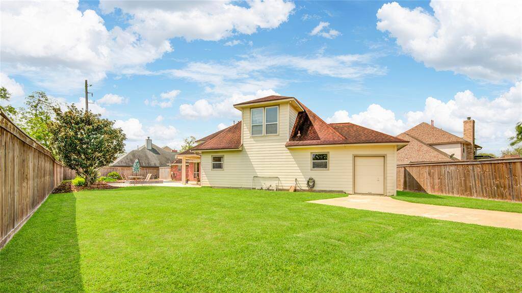 Spacious backyard with side gate and additional parking