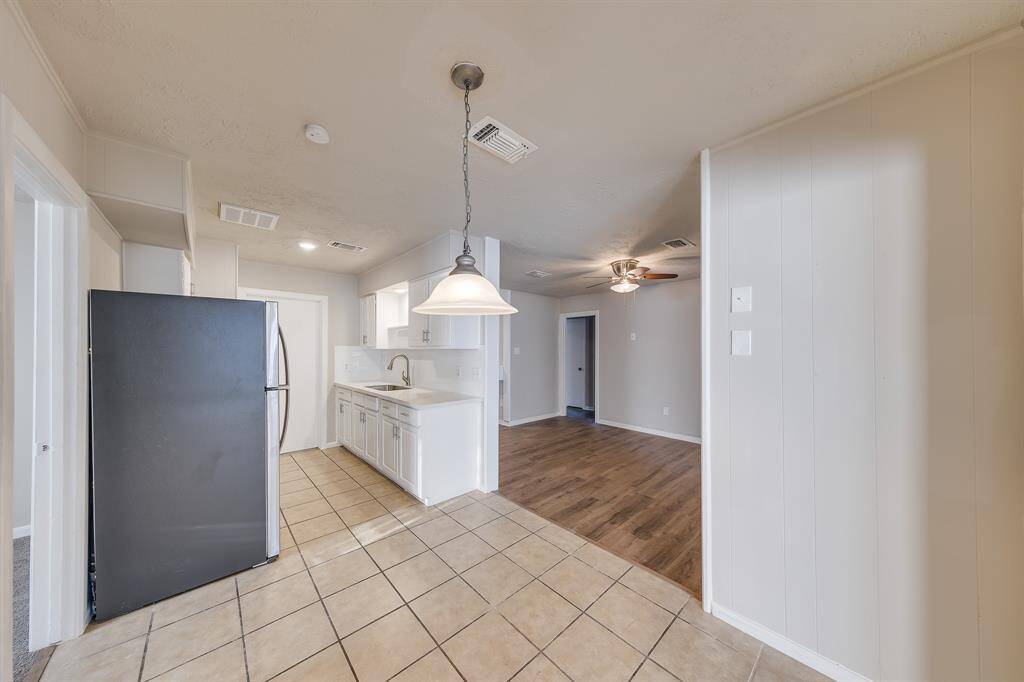 The charming breakfast area is perfectly situated directly off the kitchen, providing a cozy spot for casual meals. Its convenient location between the dining room and living area allows for easy access and a seamless flow, making it an ideal space for gatherings and everyday dining.