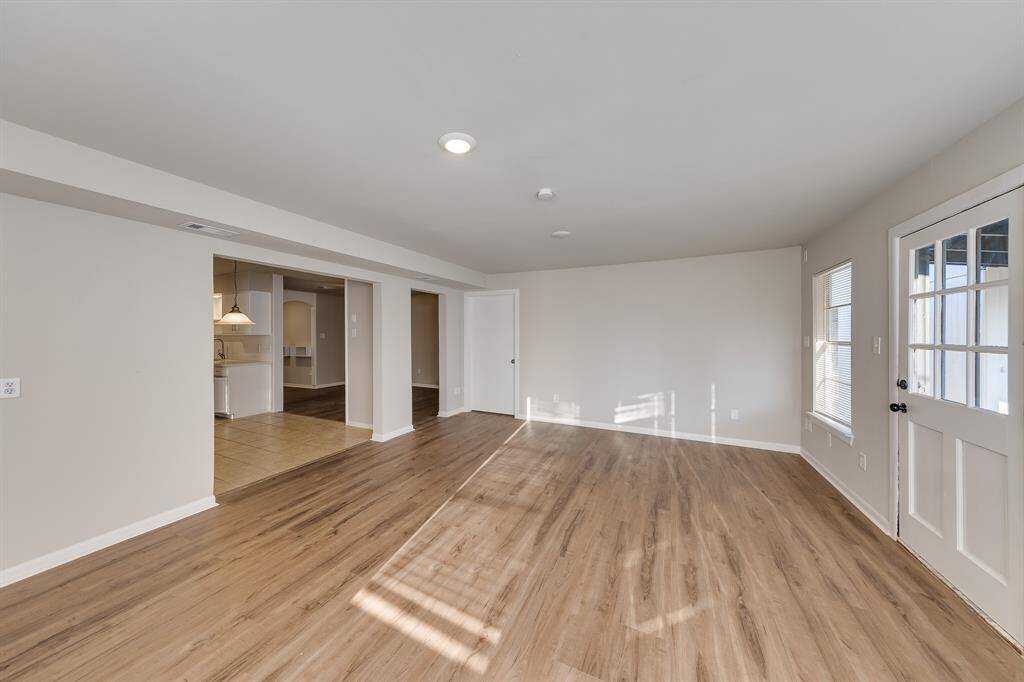 This living area features convenient entry access to the dining room, breakfast nook, and kitchen, creating a cohesive flow between spaces. This seamless connectivity enhances the overall layout, making it easy to move between areas while entertaining or enjoying everyday activities.