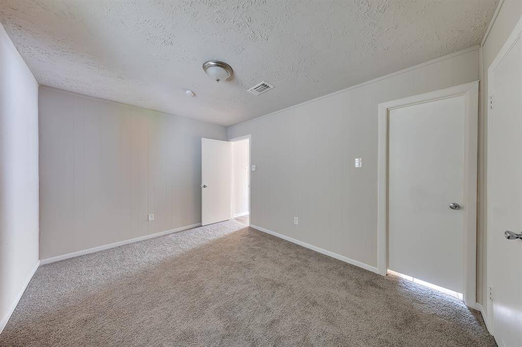 This bedroom features a spacious layout, offering great decor potential to personalize the space to your liking. With plenty of room for furniture and creative design options, it can easily transform into a cozy retreat or a vibrant, inviting area that reflects your unique style.