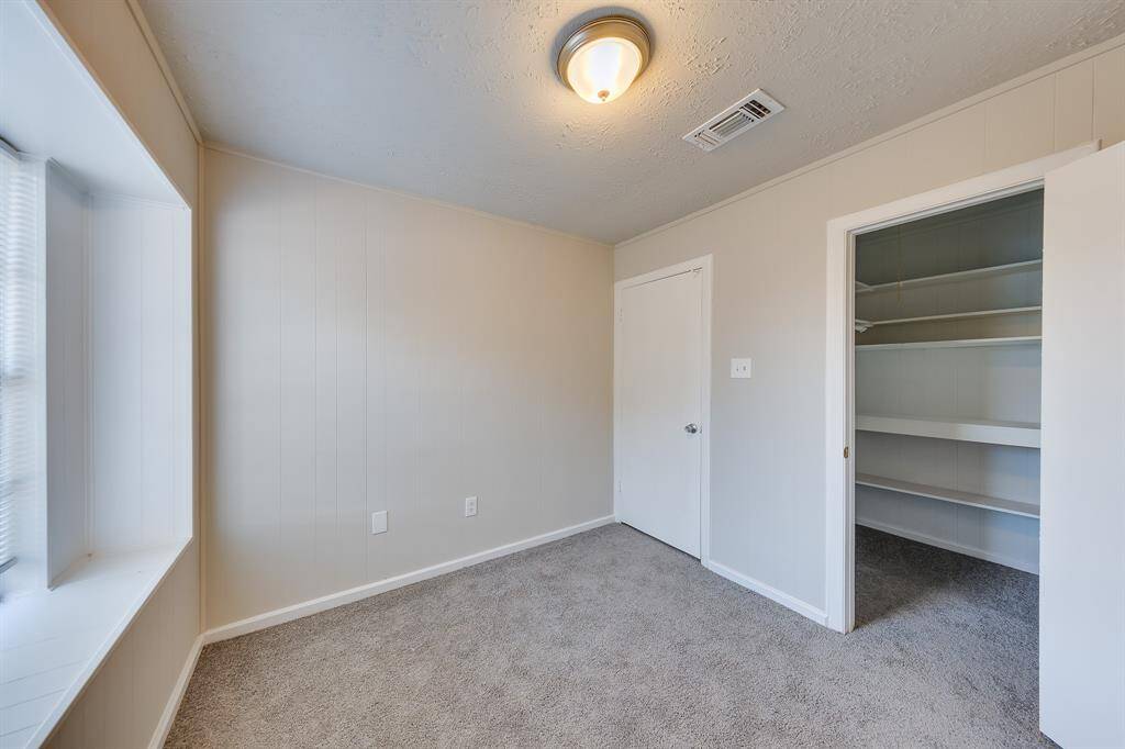 This cozy bedroom exudes a sense of privacy, making it a perfect personal retreat. It features great closet space, providing ample storage for your belongings while maintaining a warm and inviting atmosphere that you can easily make your own.