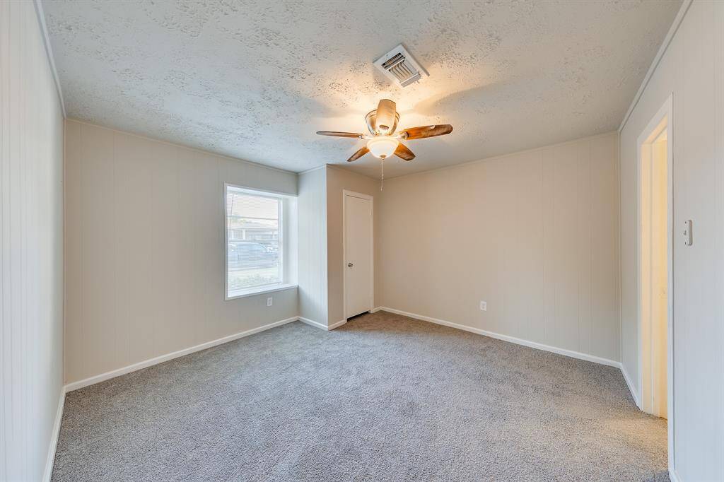 This inviting bedroom features ample natural light, creating a bright and airy atmosphere that enhances the sense of space. With generous dimensions, it offers plenty of room for comfortable furnishings and personal touches, making it a perfect retreat for relaxation.
