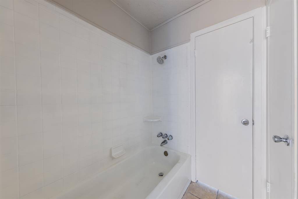 The bathroom features a versatile shower/tub combo, offering the best of both worlds for relaxation and practicality. This space allows for quick showers or leisurely baths, making it ideal for families or anyone who enjoys unwinding after a long day. Its thoughtful design ensures easy access and enhances the overall functionality of the bathroom.