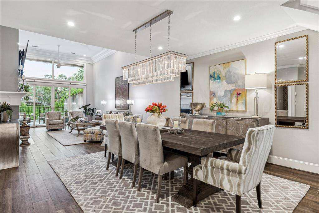 The statement chandelier in the formal dining area adds a touch of elegance, making it the perfect setting for entertaining guests in style.