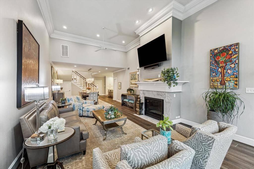The primary living areas are located on the first floor, offering a seamless flow between the kitchen, dining, and living spaces. This open-concept design enhances both functionality and comfort.