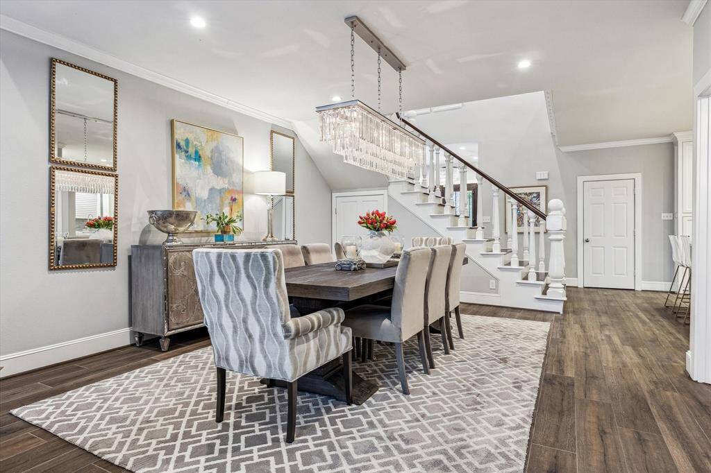 The dining room showcases a stylish and inviting space, perfect for both intimate meals and larger gatherings.